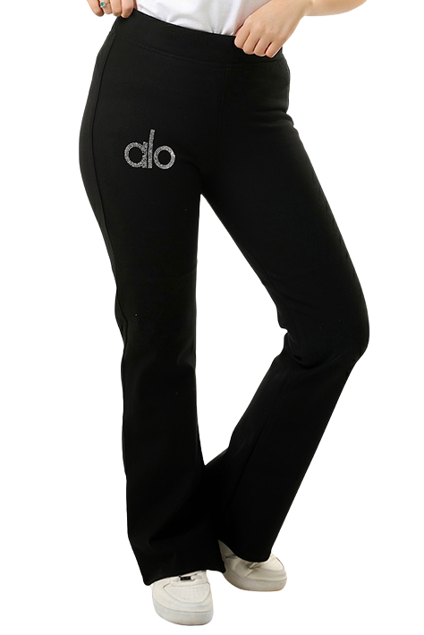 Woman wearing black pants with a logo on a white background