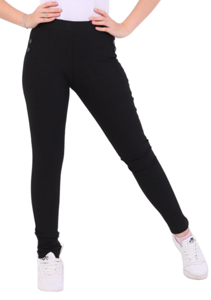 Person wearing a white sleeveless top and black leggings on a white background